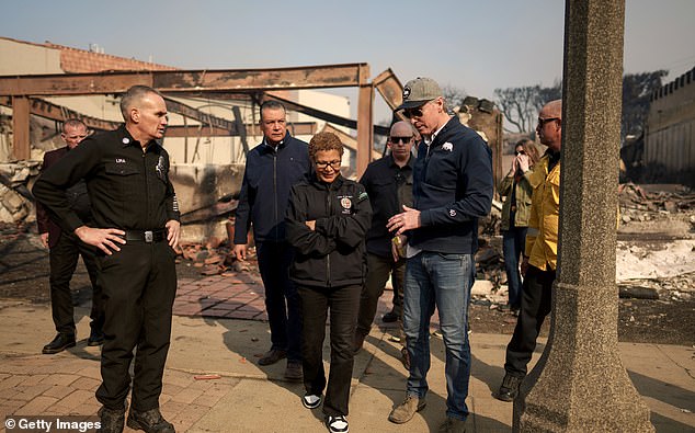 Many have complained that Los Angeles Mayor Karen Bass is AWOL in Africa, with fire hydrants running out of water and electricity and power lines left on to feed the flames. (Pictured: Bass and Gavin Newsom touring the Palisades on Wednesday)