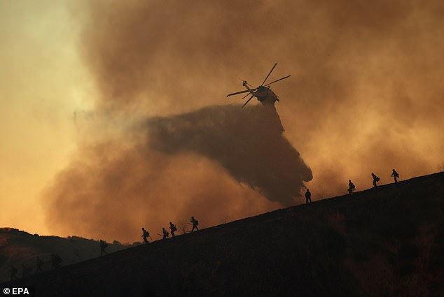 Helicopter drops water on Kenneth wildfire in Woodland Hills