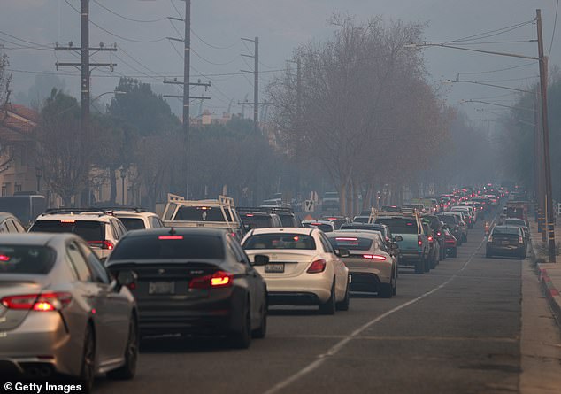 The family is among nearly 180,000 evacuees ordered to leave their homes as at least five fires continue to burn uncontrollably; Residents photographed evacuating before the Kenneth Fire on January 9, 2025 in Calabasas.