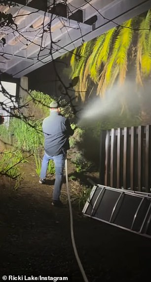 Tuesday at 4:10 p.m., Lake said Burningham used a hose to put out a fire in a palm tree on their neighbor's property