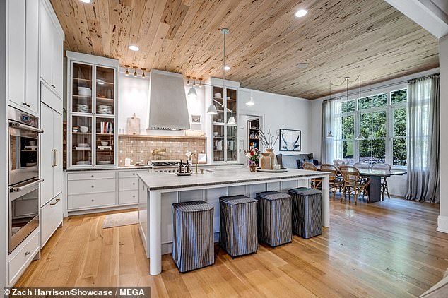 Kristin's spacious kitchen features state-of-the-art appliances, a quartzite island and a walk-in pantry