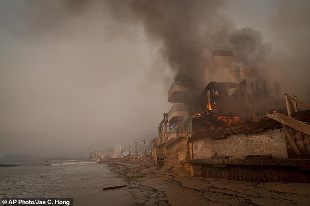 A beachfront home is burned by the Palisades Fire in Malibu, California on Thursday, January 9, 2025.