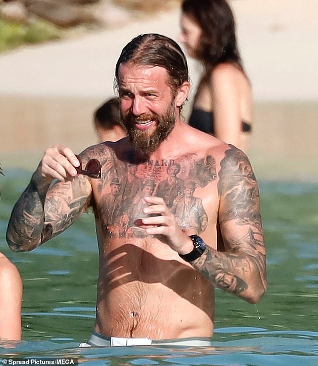 Adam Sumner, partner of Rod's daughter Renee, 32, showed off his tattooed physique while going shirtless.