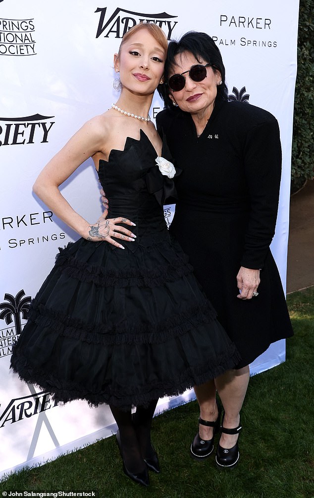 Grande's mother, Joan Grande, was also present at the meeting and matched her daughter in black.