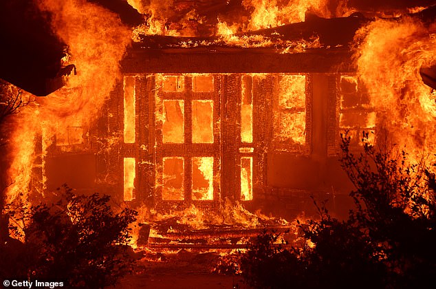 The actor is among tens of thousands of Angelenos who have been ordered to flee as wildfires continue to rage; Pictured: Flames from the Eaton Fire in Altadena engulf a home