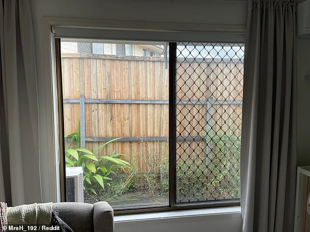 The resident said the new fence blocks natural light from entering his home (pictured)