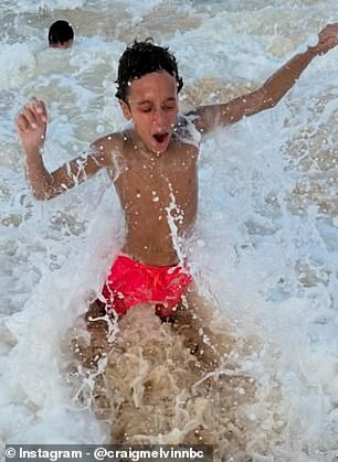 Craig's son Delano was seen splashing in the sea.