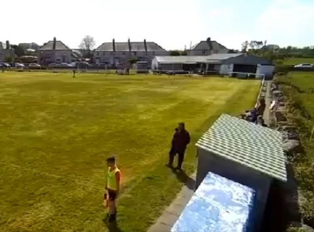 Footage shows the Amlwch linesman and coach crossing each other on the touchline in the first half.