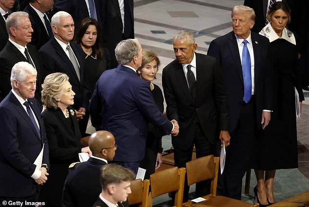 Former Presidents Obama and Bush formally shake hands during the state funeral of former President Jimmy Carter