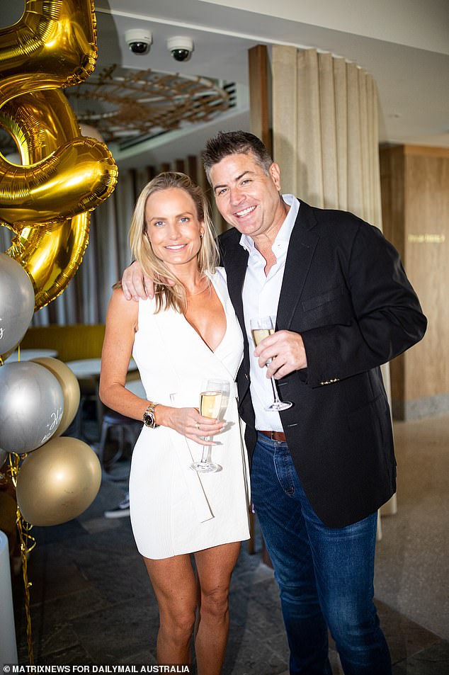 Birthday boy Stu is pictured at his party with a glamorous guest