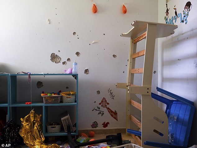 Bullet holes cover the bedroom wall of hostage Ariel Bibas, 4, in his home in Kibbutz Nir Oz, Israel.