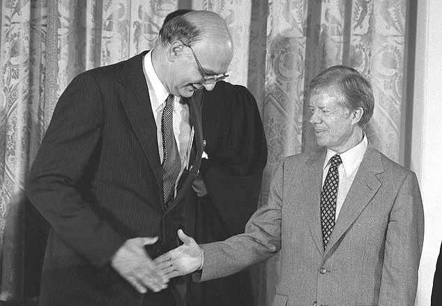 Lasting legacy: Carter (right) with Paul Volcker (left), who parachuted in as Federal Reserve chairman