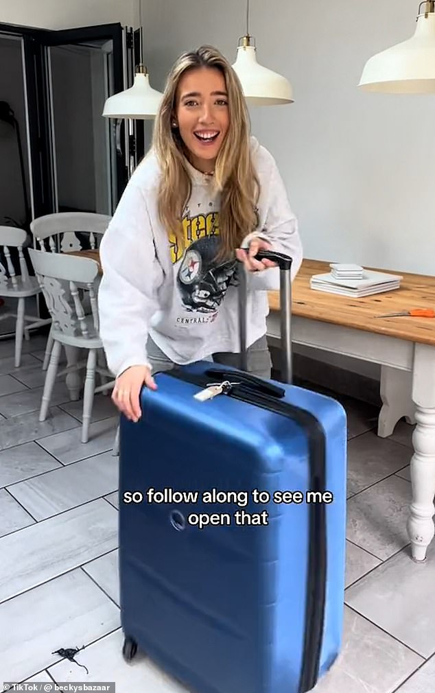 Becky Chorlton has sorted through other lost suitcases before (pictured in an old video with another case)