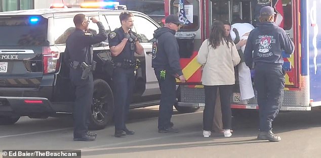 As the ambulance arrives at the house, Officer Warner can be seen carrying the child from the front yard to the back of the ambulance.