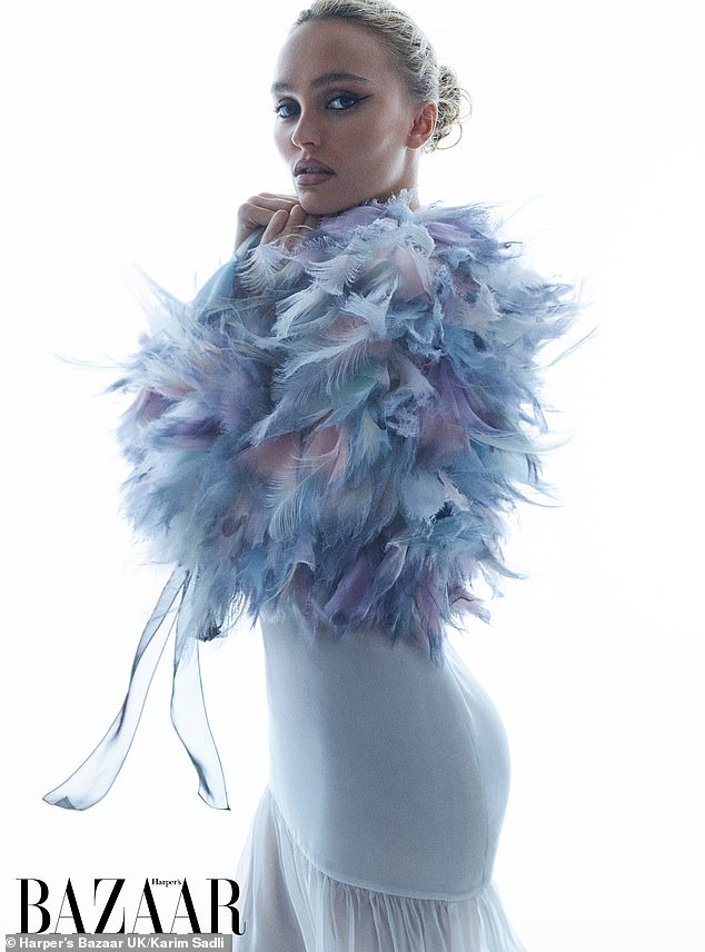 Lily-Rose modeled a series of looks including a blue and purple feathered number.