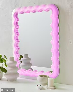 Home style lovers rush to get their hands on Kmart's trendy lighted wavy mirror, which is just $69