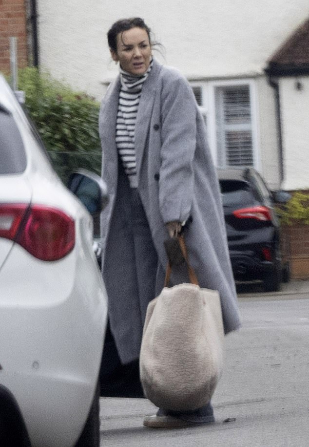 Martine was seen carrying a fluffy clutch home on Tuesday as she got ready for New Year's Eve.