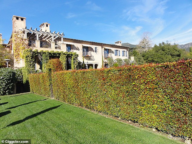 The 14,563-square-foot home, known as 'The Chateau,' sits on 5.4 acres of land and impeccably trimmed hedges line the property's stone-pillared front gates.