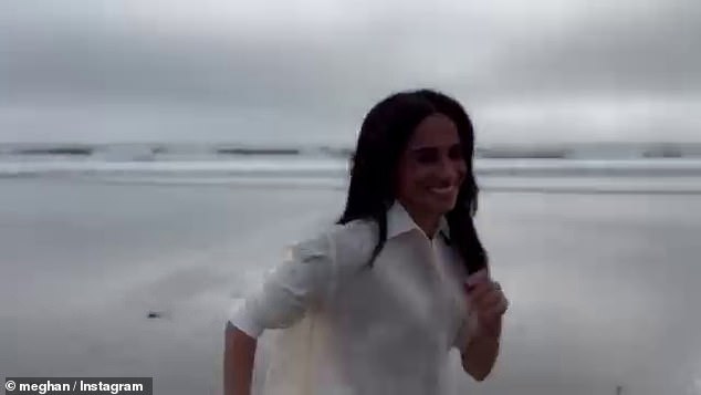 Meanwhile, in the video shared yesterday on her new account, the Duchess can be seen walking towards the shoreline of the beach, in a clip filmed by Prince Harry.