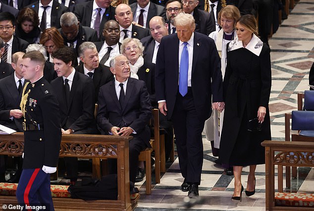 The incoming first lady wore a black dress with a dramatic oversized white collar with an abstract black and white design.