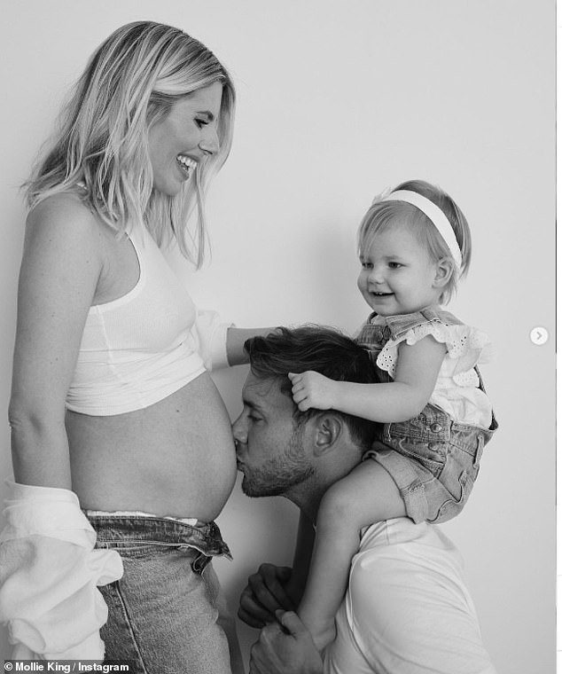 Mollie and Stuart first revealed they were expecting another child in August with a touching photo of Stuart kissing her bare bottom with Annabella sitting on his shoulders, as she revealed the little one was excited to be a 'big sister'.