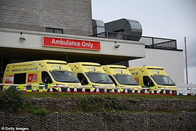 Ambulances wait outside the Royal Cornwall Hospital emergency department on January 4.