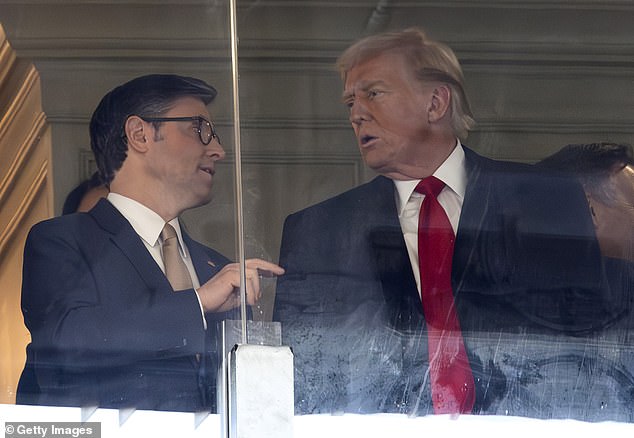 Speaker of the House of Representatives Mike Johnson (L) talks with President-elect Donald Trump during the 125th Army-Navy Football Game at Northwest Stadium on December 14, 2024 in Landover, Maryland