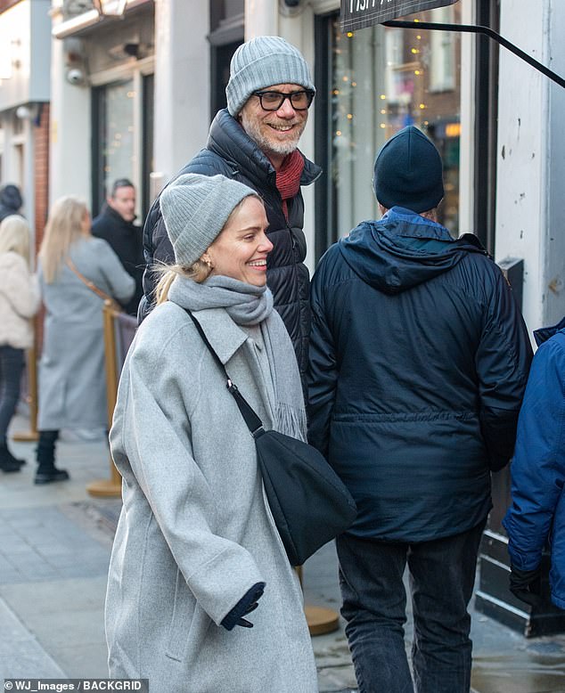 The 6ft 7in actor, 50, wrapped up in a blue winter hat, a red scarf and a navy blue quilted coat as he walked hand in hand with Mircea, who is 5ft 5in.