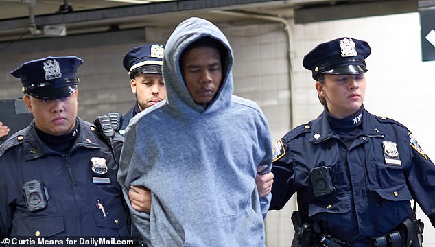 In the photos, Hawkins is wearing a gray hooded sweatshirt and navy blue pants, having changed into the clothing he was wearing at the time of the attack.