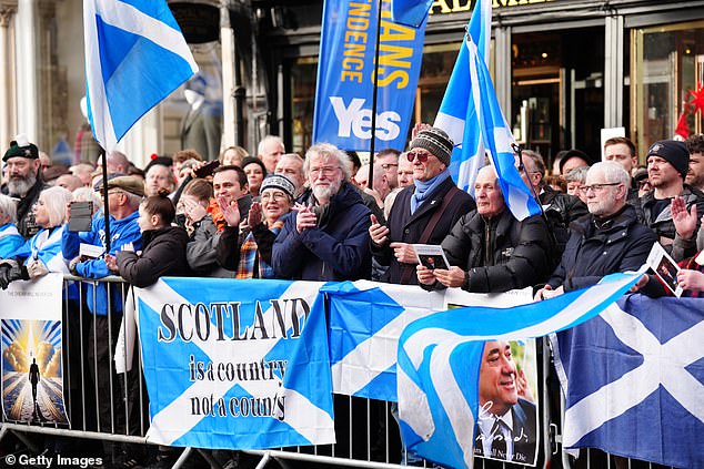 Independence supporters gather to pay their respects to former First Minister Alex Salmond at St Giles Cathedral in Edinburgh on November 30, 2024.