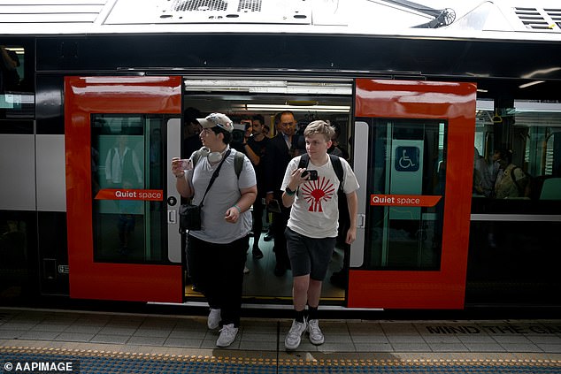 The cost of linking the two most populous cities in New South Wales could rise to more than $40 billion (pictured, passengers disembark a train at Sydney Central Station)