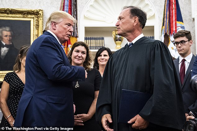 Trump pictured with Alito at the White House in July 2019. Alito claimed their call Tuesday was about a recommendation for a former law clerk for a position and that they had not discussed pending cases in court.