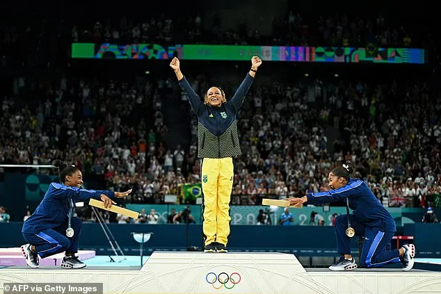 Biles (L) and Jordan Chiles (R) bowed to Rebeca Andrade after their victory in the floor final